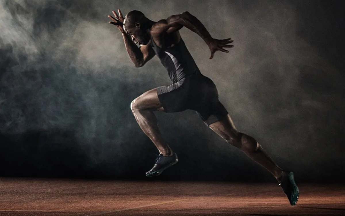 A sprinter driving out of the blocks